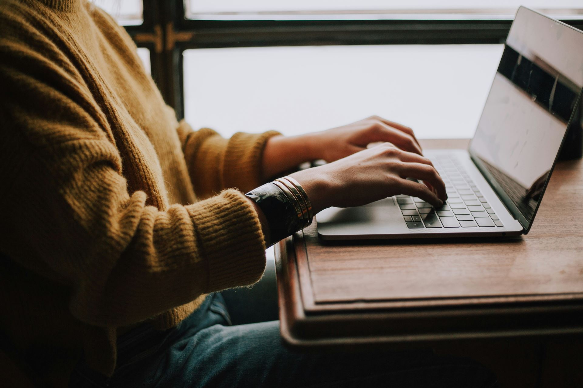 Typing on laptop